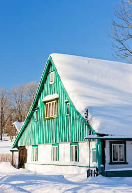 Cottage in winter, Kunstat - Jadrna, Orlicke Mountains, Czech Re clipart