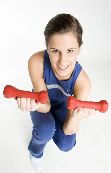 Žena cvičení s němý zvony — Stock fotografie