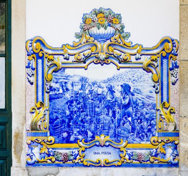 Tiles (azulejos) at railway station of Pinhao, Douro Valley, Por clipart