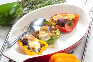 Peppers filled with champignons and chicken livres baked with mo clipart