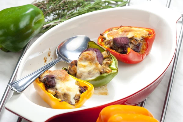 Peppers filled with champignons and chicken livres baked with mo — Stock Photo, Image