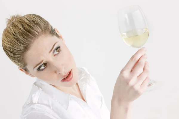 Portrait of young woman with a glass of white wine — Stock Photo, Image