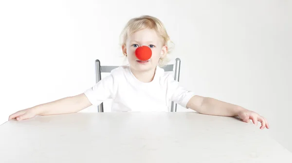 stock image portrait of little girl with a clown nose