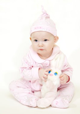 Baby girl with a toy clipart