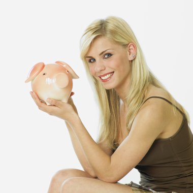 Woman with a piggy bank clipart