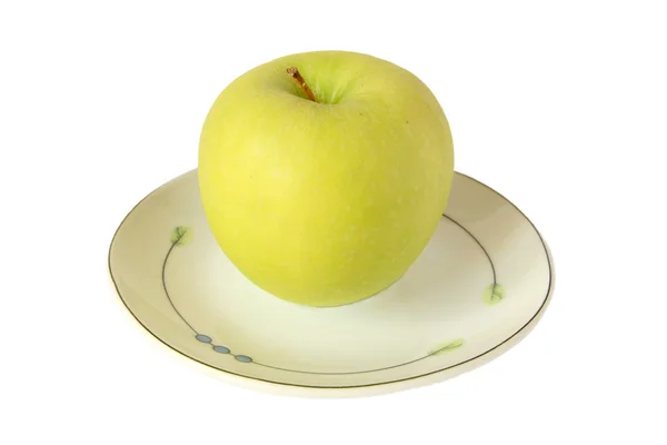 Jabłko na talerzu — Zdjęcie stockowe