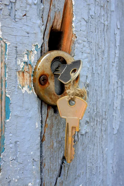 Two keys in the old door lock — Stock Photo, Image