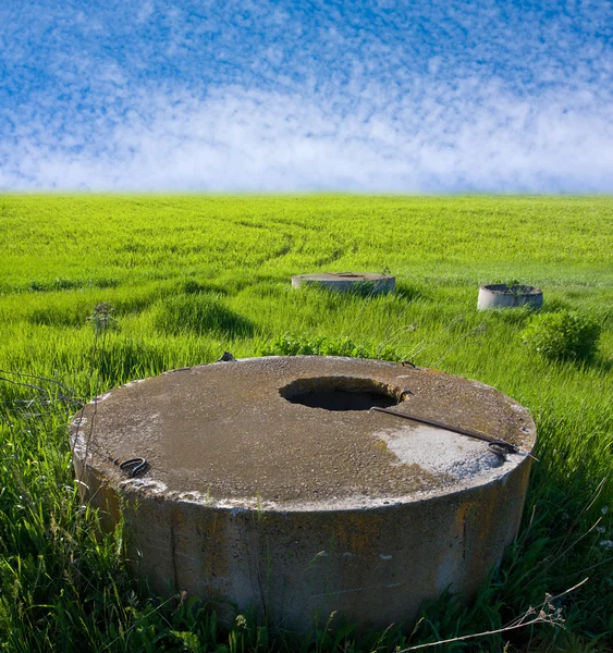 stock image Wells on green farm land