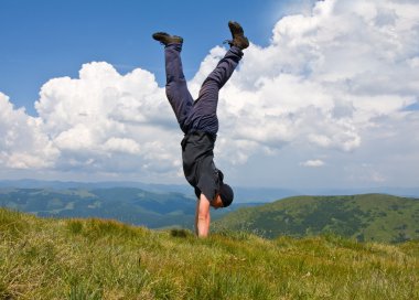 Happy man in mountains clipart