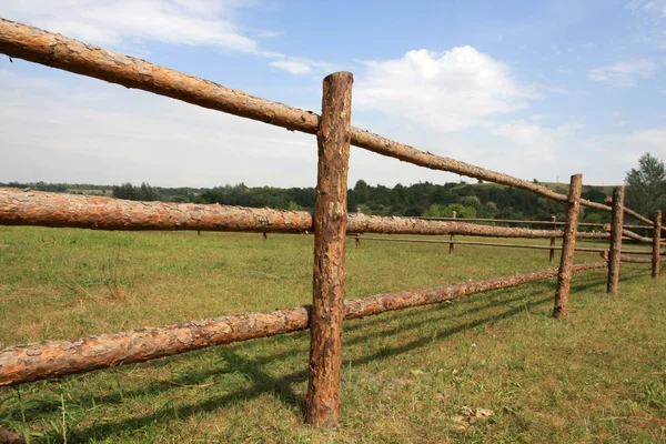 Wooden fence on meadov — Stock Photo, Image