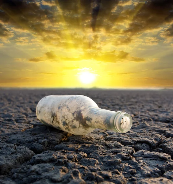 Old thrown out bottle — Stock Photo, Image