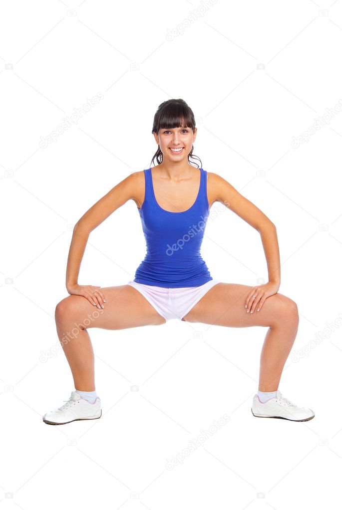Beautiful fitness trainer squats