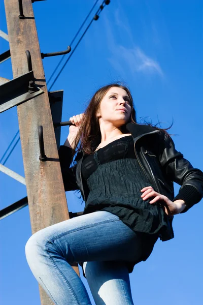 Woman on electrical tower — Stock Photo, Image