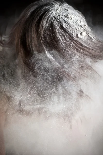 Young woman covered in flour Stock Photo