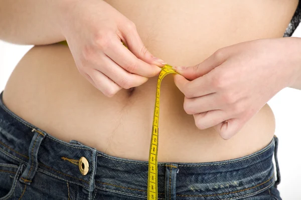 stock image Young girl measuring her belly