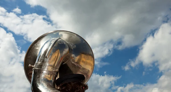 Brass tuba outdoors on a cloudy day — Stock Photo, Image