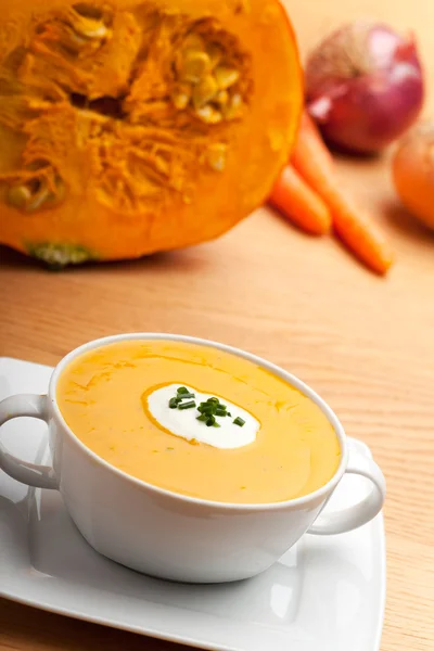 Pumpkin soup in a white bowl — Stock Photo, Image