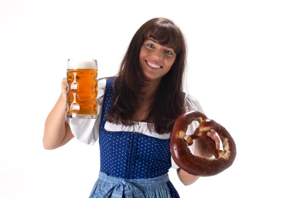 Woman in a bavarian dress with beer and pretzel — Stock Photo, Image