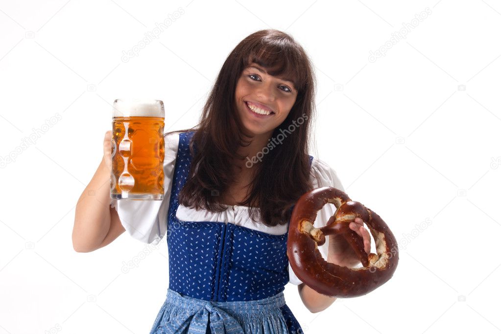 Woman in a bavarian dress with beer and pretzel