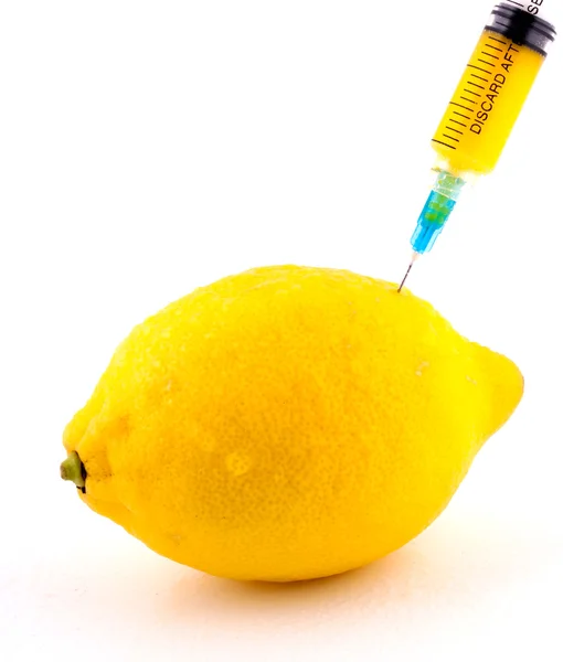 stock image Lemon With Syringe Injecting Color