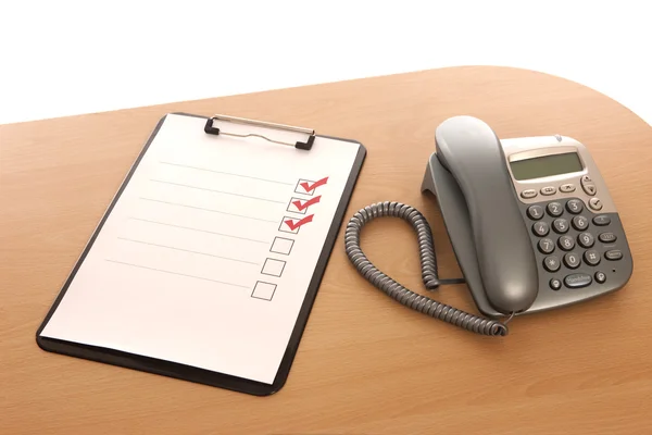 Clipboard and telephone — Stock Photo, Image