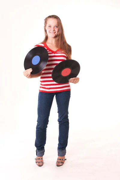 Young pretty model posing with two vinyl records — Stock Photo, Image