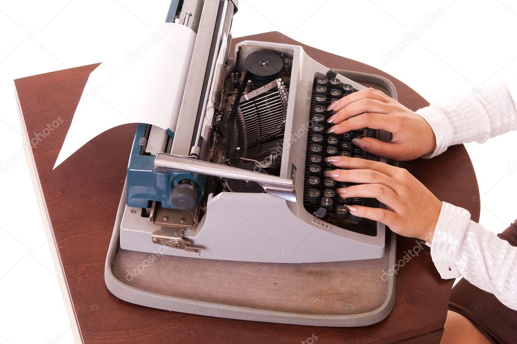 Vintage typewriter with long-nail female fingers