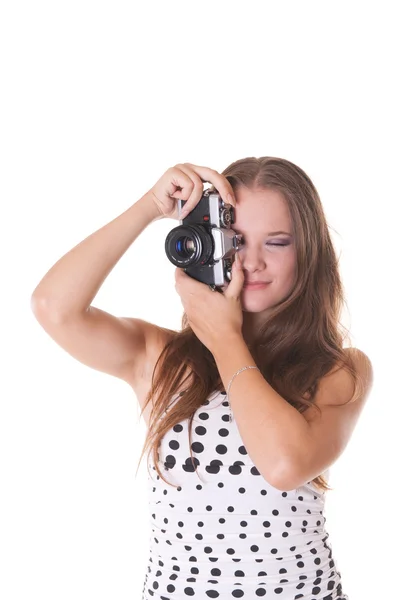 Young female model in polka dot dress posing with 35mm camera — Stock Photo, Image