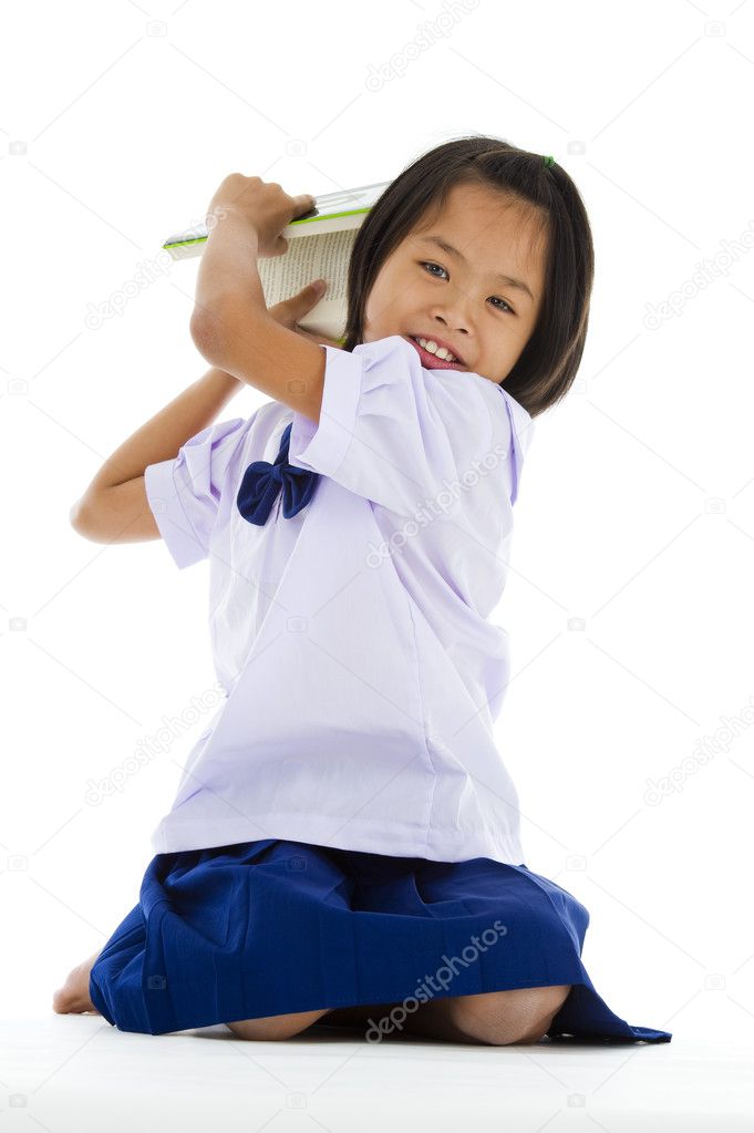 Cute girl throwing a book