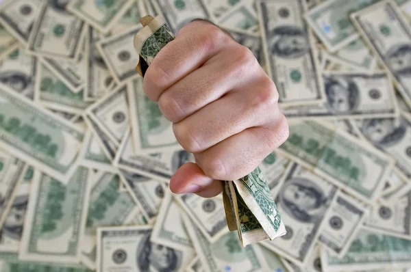 Fist with dollar bills — Stock Photo, Image