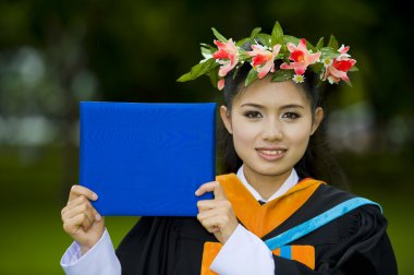 Asian student on her graduation day clipart