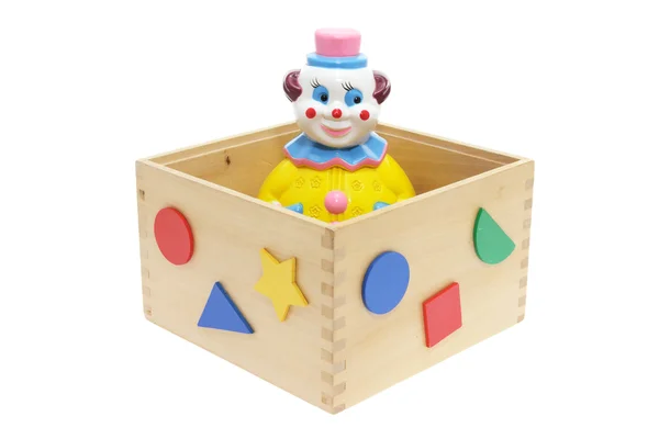 Palhaço de brinquedo em caixa de madeira — Fotografia de Stock