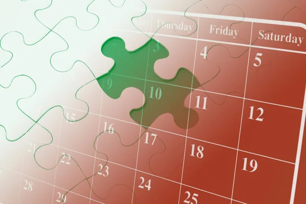 Puzzle a kalendář — Stock fotografie
