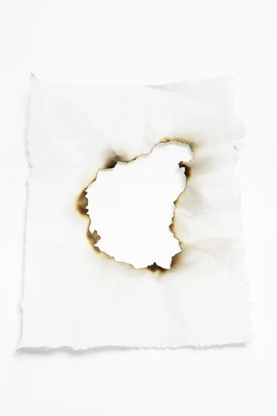 Papír s spálené otvorem — Stock fotografie