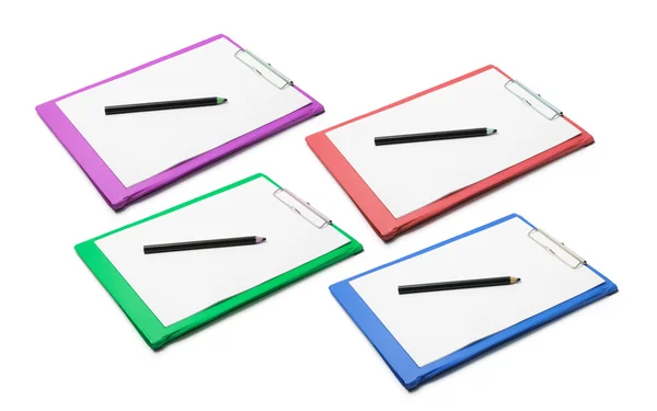 Portapapeles con papeles en blanco y lápices — Foto de Stock