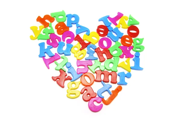 Alfabetos dispostos em forma de coração — Fotografia de Stock
