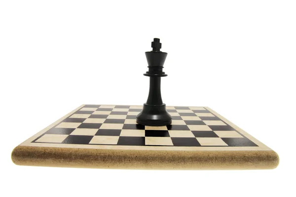 Král šachová figurka na šachovnici — ストック写真