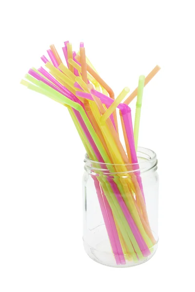 Pajitas de plástico para beber en tarro de vidrio —  Fotos de Stock