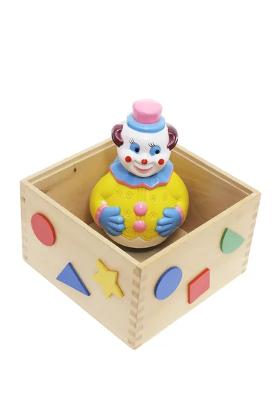 Payaso de juguete en caja de madera — Foto de Stock