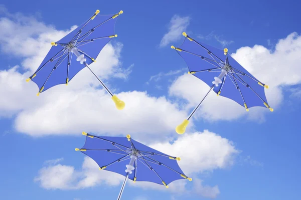 Paraplyer och moln — Stockfoto