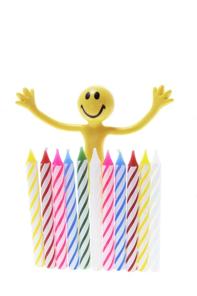 Smiley figur och födelsedag ljus — Stockfoto