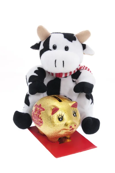Soft Toy Cow and Golden Piggy Bank — Stock Photo, Image
