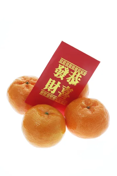 Mandarins and Red Packet — Stock Photo, Image
