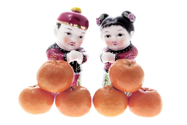 Китайские фигуры и мандарины — стоковое фото