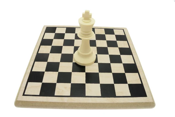 King Chess Piece on Chess Board Stock Photo