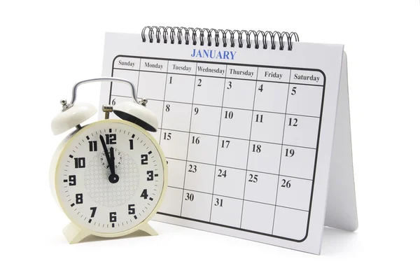 Будильник и календарь — стоковое фото