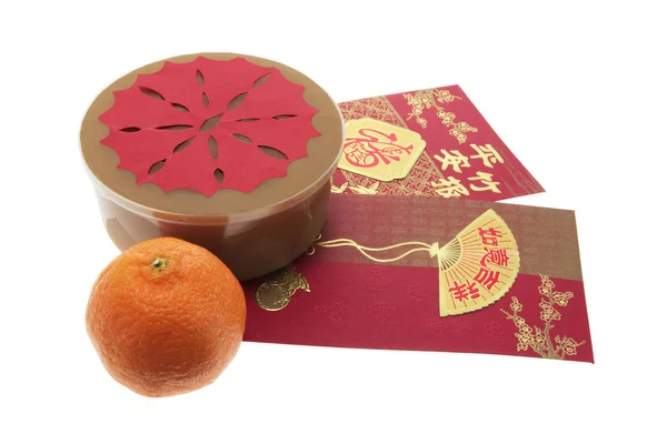 Κινέζικη Πρωτοχρονιά κέικ και κόκκινο πακέτα — Φωτογραφία Αρχείου