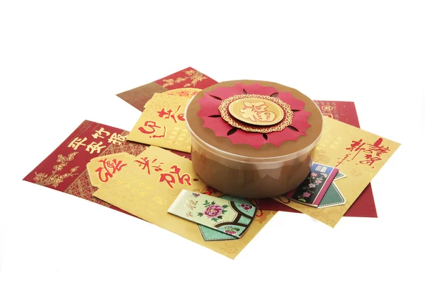 Pastel de Año Nuevo Chino y paquetes rojos — Foto de Stock