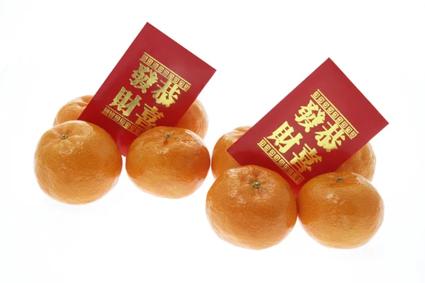 Mandariner og røde pakker – stockfoto