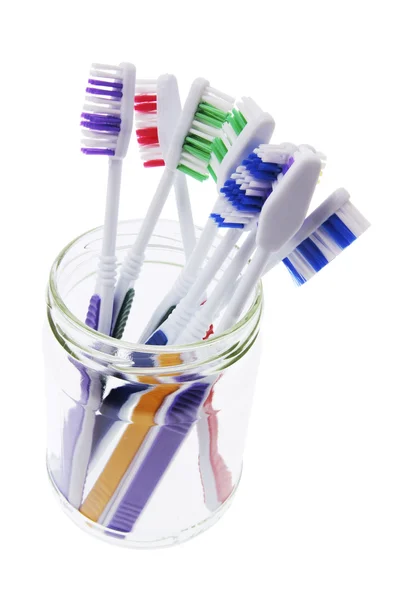 Cepillos de dientes en tarro de vidrio — Foto de Stock